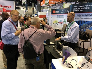 Rod Hamar talking with visitors about the new L-702SP Spindle Alignment Laser with Scan Plane